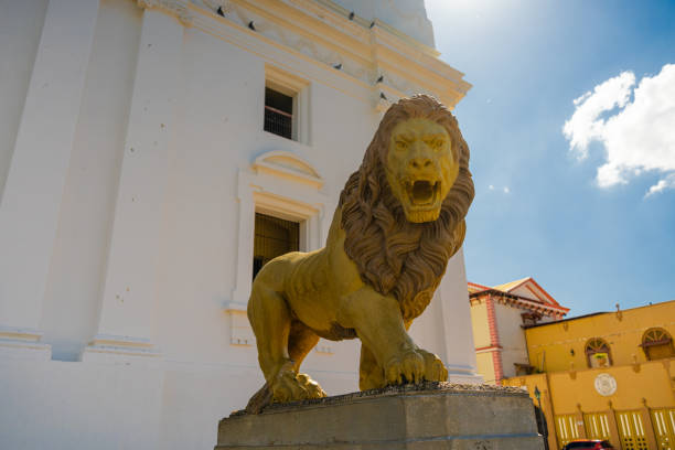 A statue of a friendly looking lion on the memorial to Admiral Lord Nelson in St Pauls Cathedral London.The lion has long been used as a symbol for the United Kingdom.