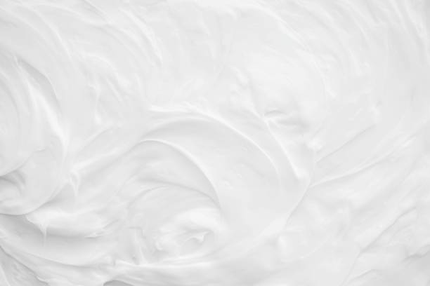 istock White surface of the cream lotion softens the background. 1366103295