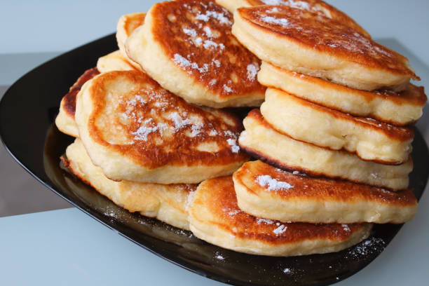 istock Fresh pancakes on a plate on the table. Close-up. Background. 1366104380