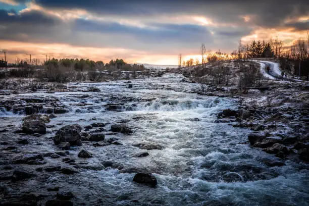 Photo of Winter sunset over the Ellidaa river in Reykjavik, Iceland.