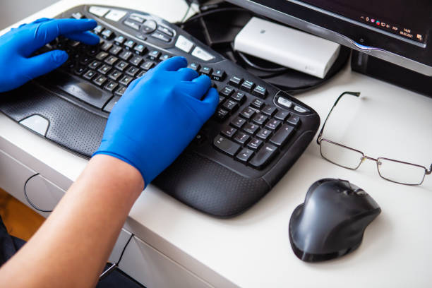 A doctor in blue gloves quickly collects data about a patient. The concept of healthcare and taking care of your health. A doctor in blue gloves quickly collects data about a patient. The concept of healthcare and taking care of your health patient-filing-system stock pictures, royalty-free photos & images