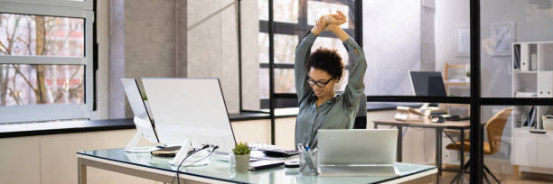 istock Arms Stretch Exercise Sitting At Desk 1366115734