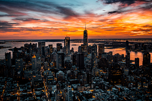 Magnificent aerial view of New York cityscape with all the skyscrapers seen during the beautiful sunset from a helicopter.