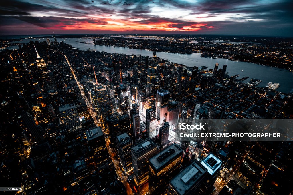 Magical Sunset in New York Magnificent aerial view of New York cityscape with all the skyscrapers seen during the beautiful sunset from a helicopter. Times Square - Manhattan Stock Photo