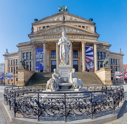 Berlin - The Konzerthaus building and the memorial of Friedrich Schiller Gendarmenmarkt square.
