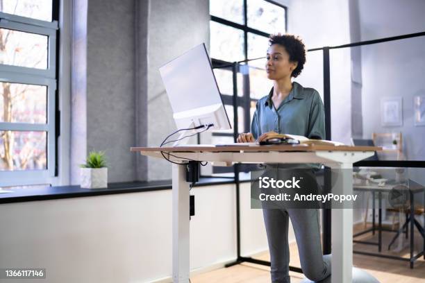 Adjustable Height Desk Stand In Office Stock Photo - Download Image Now - Adjustable, Desk, Office