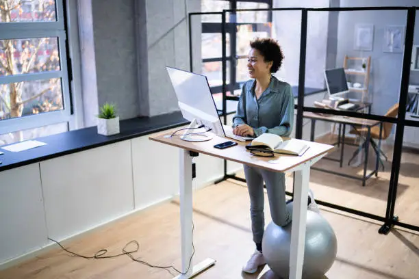 Photo of Adjustable Height Desk Stand In Office