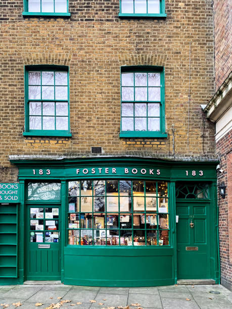 Foster bookshop London, England Chiswick High Road street view. Famous Foster Books shop decorated with dark green framed shop window. Brick wall, cobblestone. Front view chiswick stock pictures, royalty-free photos & images