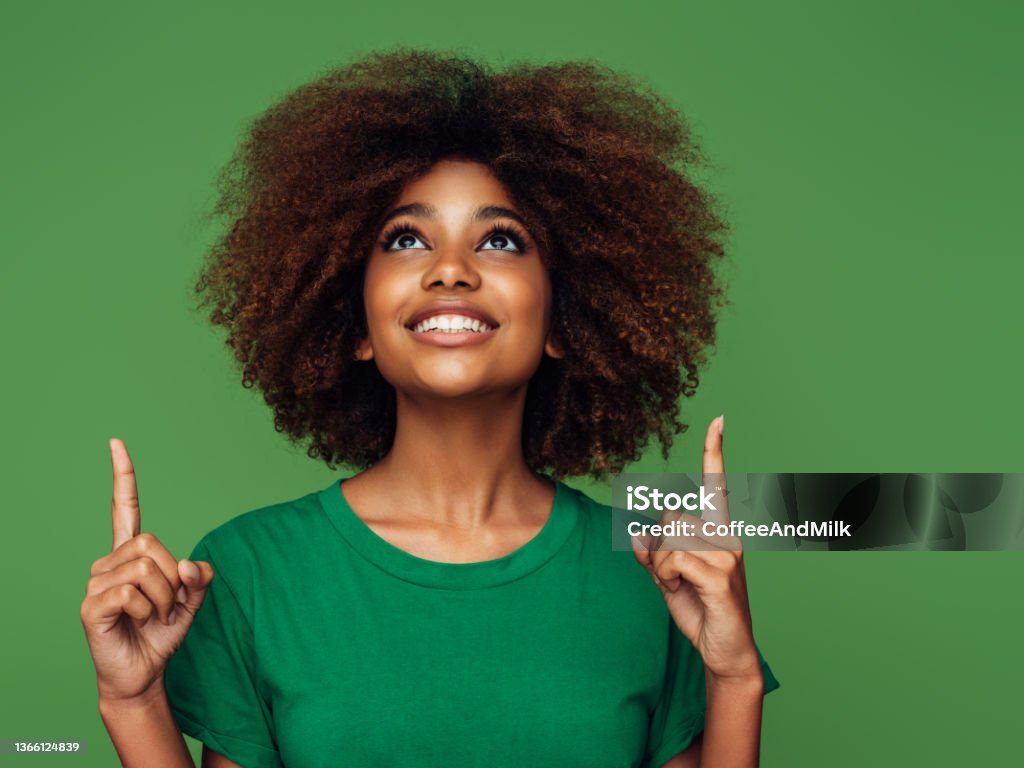 Beautiful afro woman Pointing Stock Photo
