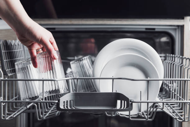 istock Open dishwasher with clean cutlery, glasses, dishes inside in the home kitchen 1366126246