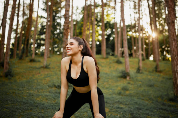 istock Young woman after jogging catching her breath. 1366127228