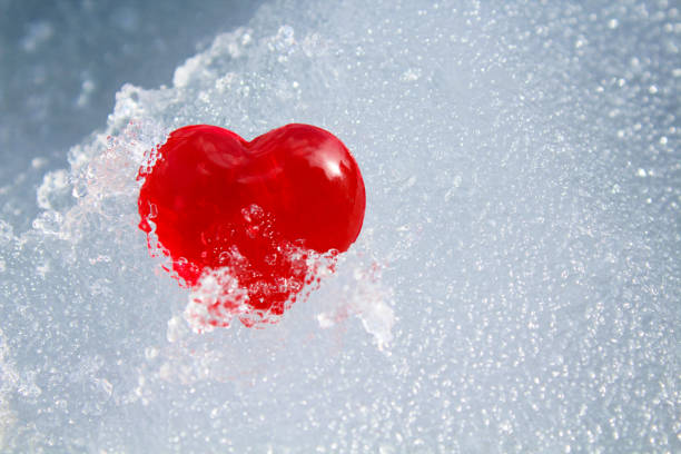 istock Red heart in ice. Close-up. Background. Texture. 1366131895