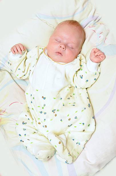 istock Newborn baby sleeps 136613470