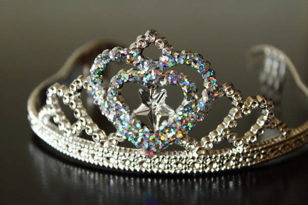 istock Beautiful shiny plastic crown for children. Close-up. Background. 1366135401