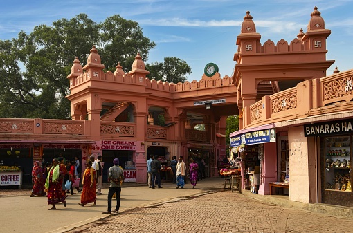 Varanasi, India, November 22, 2015: View of the entrance into the area of the Shri Vishwanath Temple (Shri Vishwanath Mandir). The swastika (on the towers) is in Hinduism considered an holy symbol used on all possible occasions. It can be seen on the Hindu temples and in India it has nothing to do with Nazism.