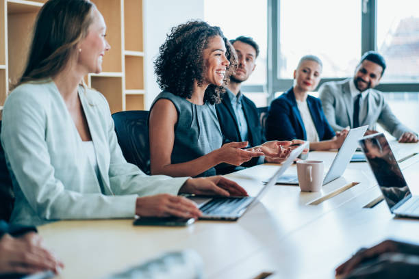 Business persons on meeting in the office. Group of business persons in business meeting. Group of entrepreneurs on meeting in board room. Corporate business team on meeting in the office. business conference photos stock pictures, royalty-free photos & images