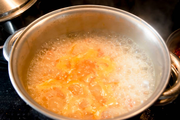 istock White brown rice cooking in the pan in a kitchen. 1366139077