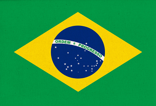 Flag of Brazil. Brazilian flag on fabric surface. Brazilian national flag on textured background. Fabric Texture. Brazilian country. Federative Republic of Brazil