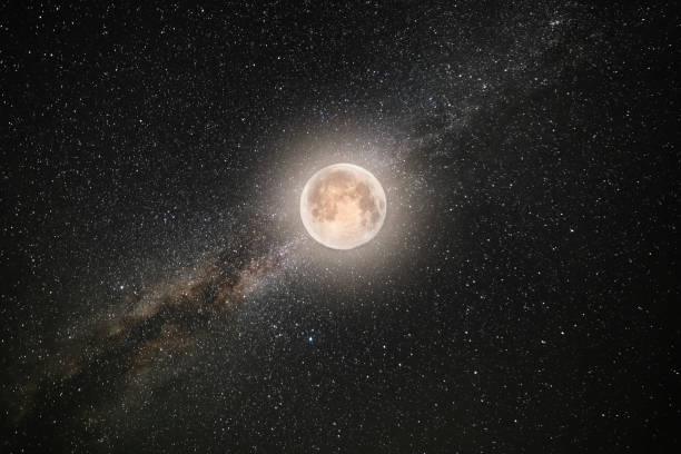 istock Bright milky way galaxy and full moon. Night starry sky background. 1366139338