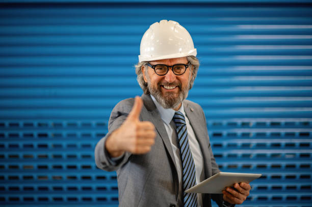istock Senior engineer in a factory 1366140403