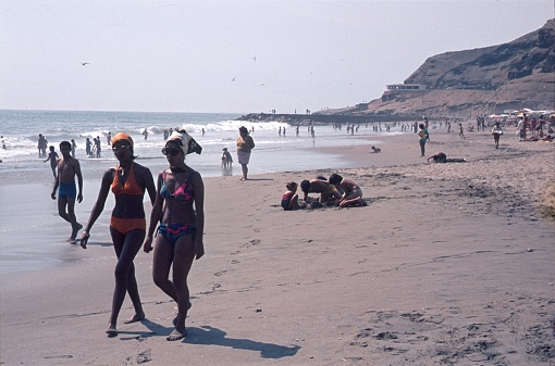 Brazil (exact location not known), 1976. Beach scene with locals and vacationers on the Brazilian coast.