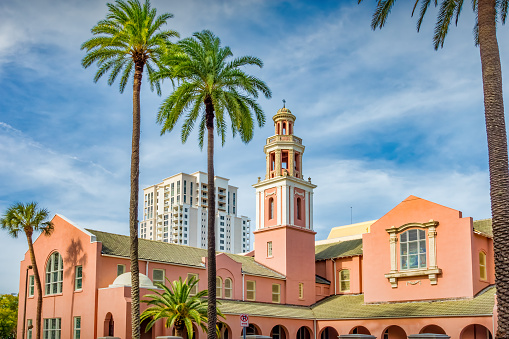 The ornate Peace Memorial Presbyterian Church and palm trees in downtown Clearwater Florida USA .