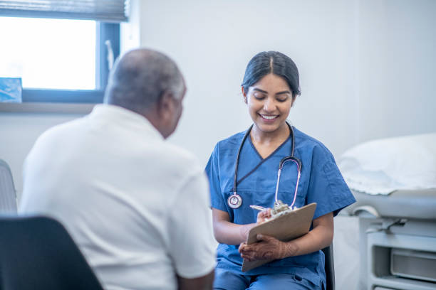 istock Nurse discusses with senior patient 1366151783