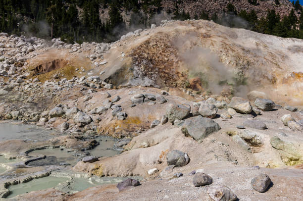 istock Hot Springs and Clay from Decomposed Rock, Bumpass Hell, Lassen Volcanic National Park, California. Steam and hot water lakes on the surface of thee ground. 1366152603