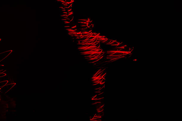 istock Ballet dancer dancing in front of and red light while expressing the hell with her magnificent dance moves. 1366153309