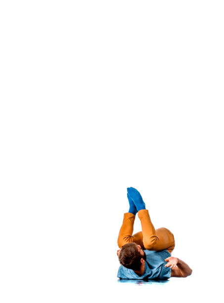 The man lay and gesture on the white background. View from above