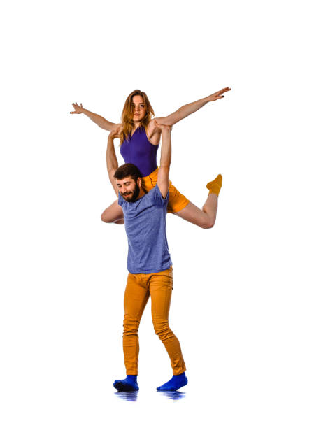 The two young modern ballet dancing over white studio background