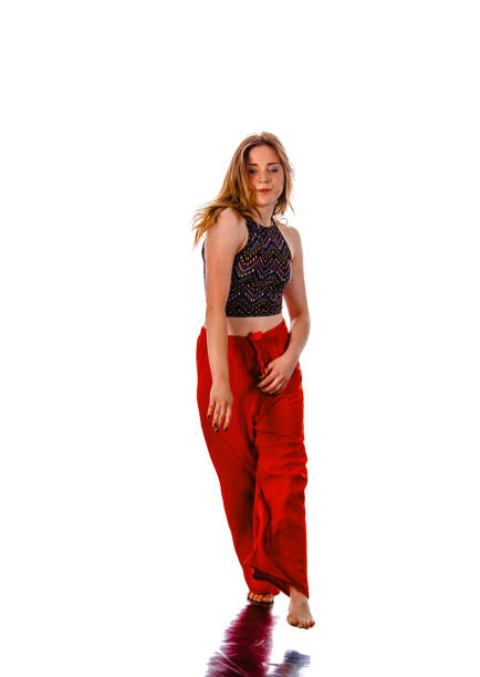 Happy girl working out dance standing with hands up. Dynamic woman fitness trainer dancing for fun