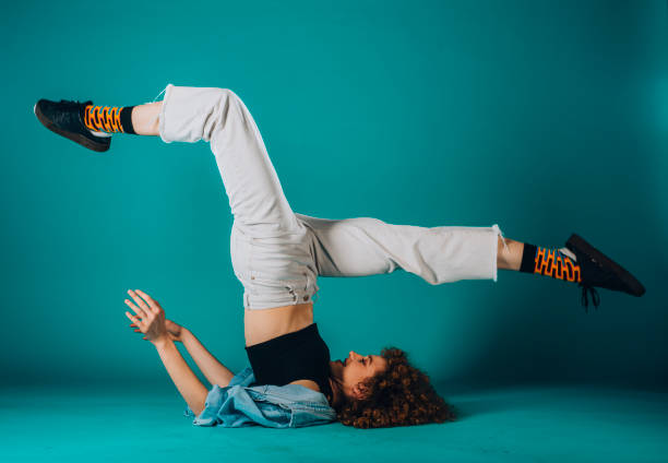 istock Athletic contemporary dancer isolated on dark wall 1366153723