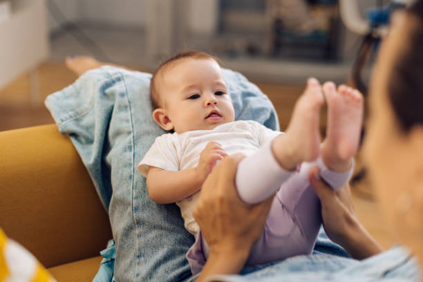 istock Young mother having fun with cute baby 1366153851