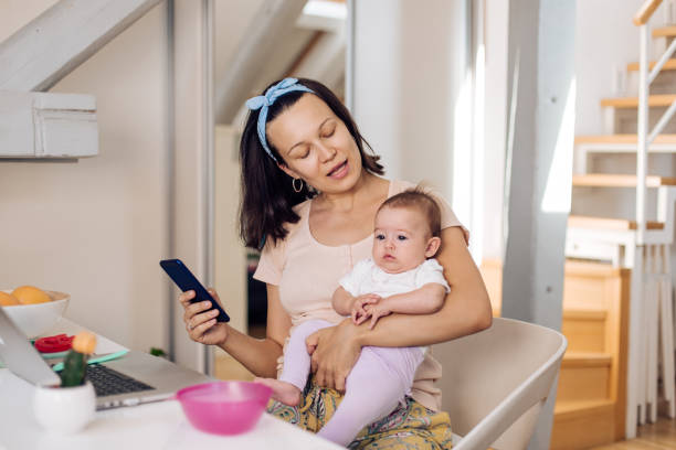 istock Mother With Baby Working In Office At Home 1366153867