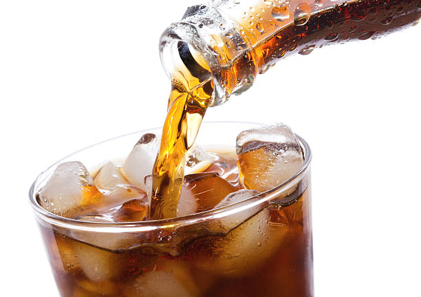 istock Coca Cola being poured into glass 136616102