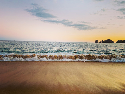 Morning reflection on wet rocks at beach - Cape Patterson