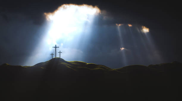 Light and Clouds on Golgotha Hill The Death and Resurrection of Jesus Christ and the Holy Cross The sky over Golgotha Hill is shrouded in majestic light and clouds, revealing the holy cross symbolizing the death and resurrection of Jesus Christ. forgiveness stock pictures, royalty-free photos & images