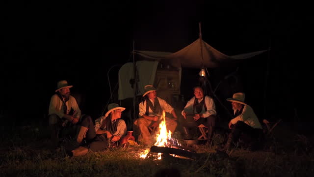 Cowboys Gathering Around The Campfire