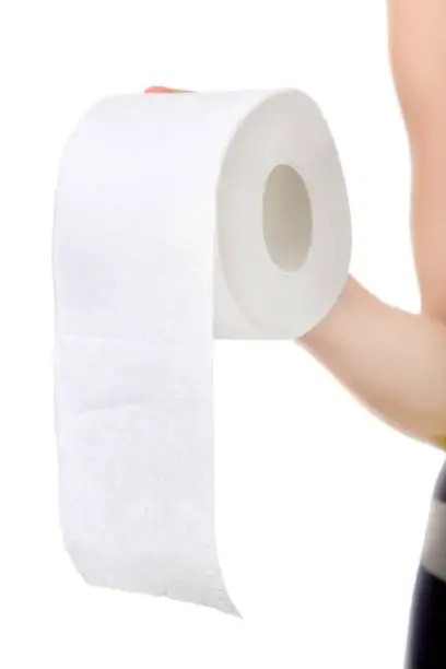 Toilet Paper in the Hand on the White Background closeup