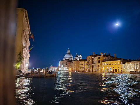 Grand Canal, medieval architecture, basilica in Venice, Italy at night.