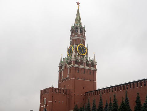 Red Square. The Spasskaya Clock Tower against a cloudy sky. Close-up, copy space. Moscow, Russia.