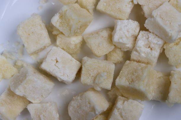 istock Frozen paneer or cottage cheese on white background, dairy product, processed food 1366188094