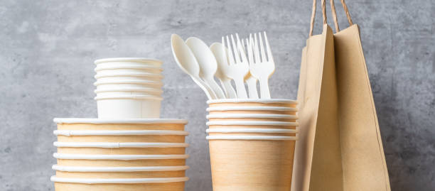 istock Eco friendly food packaging on table background. natural container: cup, plate, spoon and fork. zero waste, pollution, earth day, free plastic, world Environment day concept 1366188310