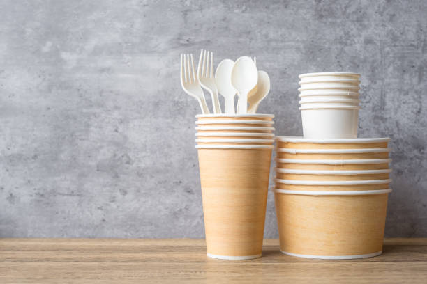 istock Eco friendly food packaging on table background. natural container: cup, plate, spoon and fork. zero waste, pollution, earth day, free plastic, world Environment day concept 1366188332