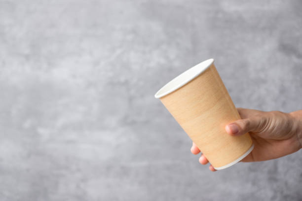 istock Eco friendly food packaging or takeaway coffee cup. Hand holding natural container for to go. zero waste, pollution, earth day, free plastic, world Environment day concept 1366188399