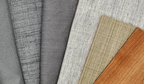 istock close up view of grey drapery and wooden laminated samples swatch. grey curtain samples. brown oak and ash veneer samples. interior material board for selection. 1366189124