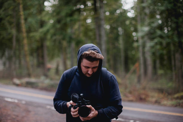 istock Filmmaker in Oregon Forest with Camera 1366190060