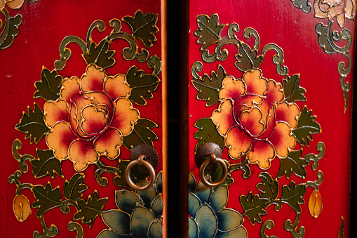 Old wooden door with floral pattern.Wooden cabinet flower pattern.