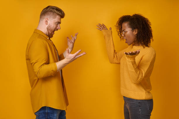 istock Two attractive angry aggressive nervous people having fight anger blame 1366194140